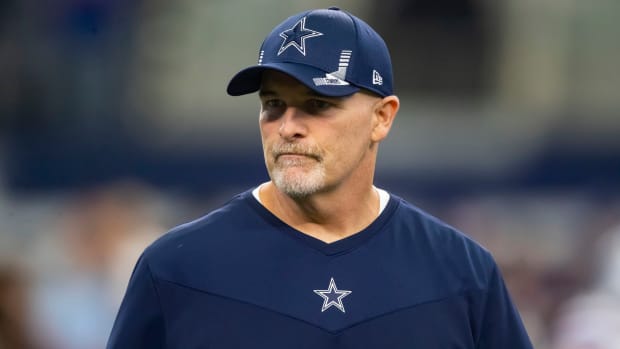 Dan Quinn stands on the sideline